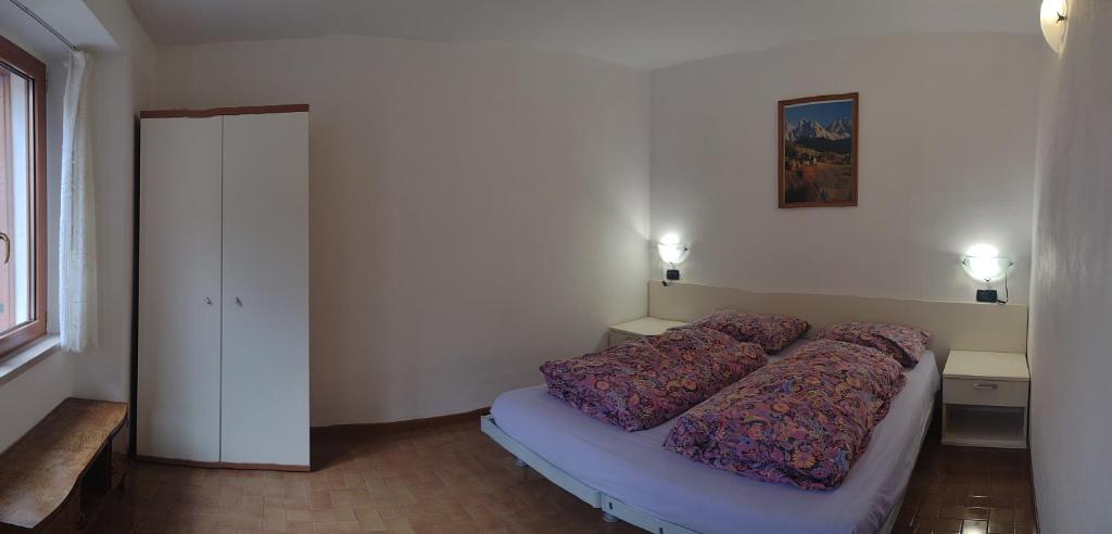 Postel nebo postele na pokoji v ubytování Casa Bruna Tignale