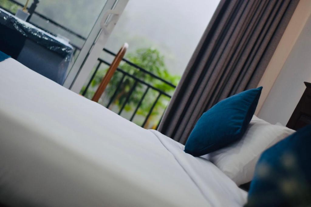 Postel nebo postele na pokoji v ubytování Relax Inn
