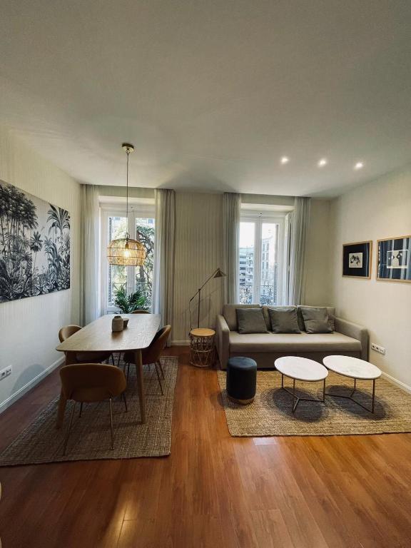 a living room with a couch and a table at New Stylish Apt 5pax en la Plaza de Espana in Madrid