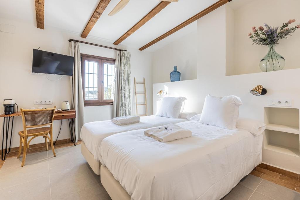 Katil atau katil-katil dalam bilik di Hospedium Hotel Rural Virgen María