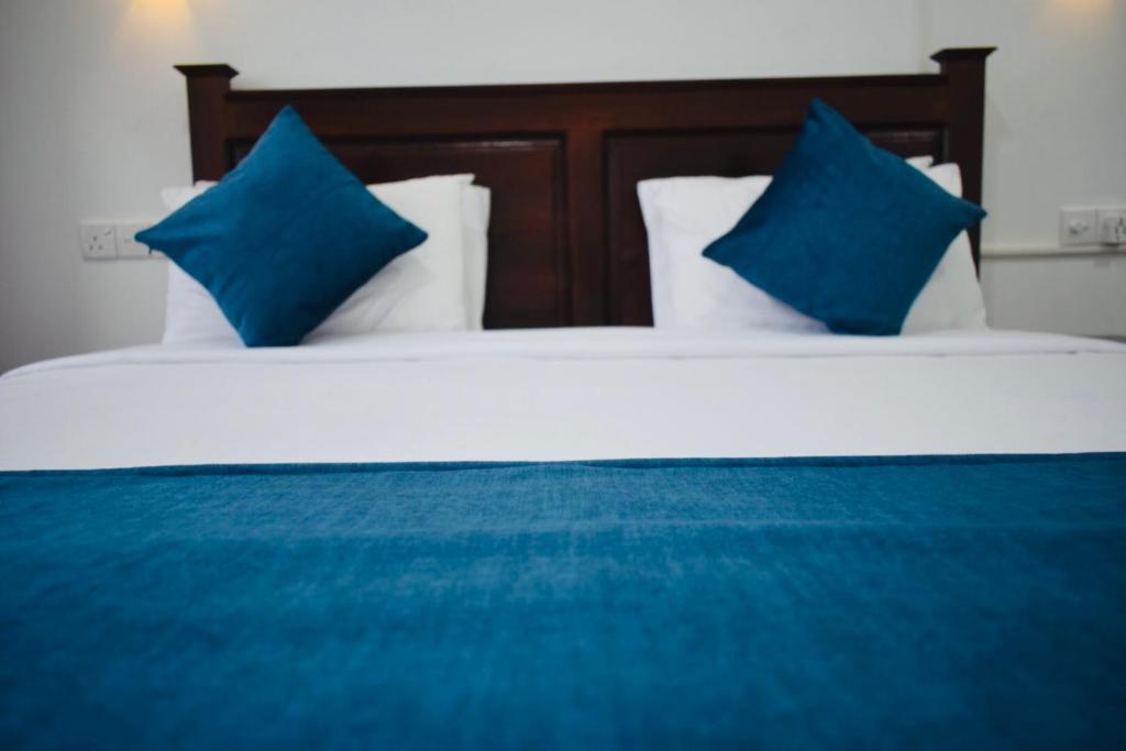 Postel nebo postele na pokoji v ubytování Relax Inn