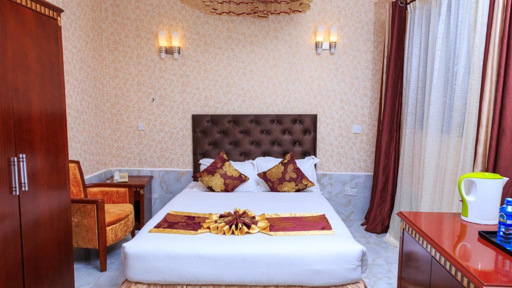 Postel nebo postele na pokoji v ubytování Easy Hotel Kenya