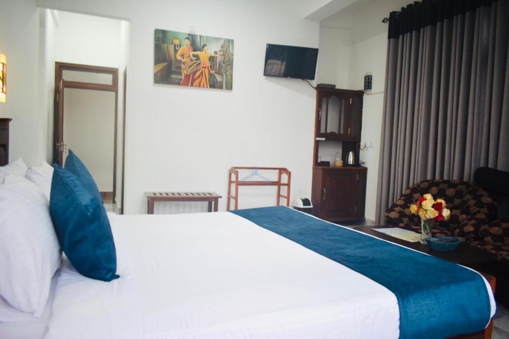 Postel nebo postele na pokoji v ubytování Relax Inn
