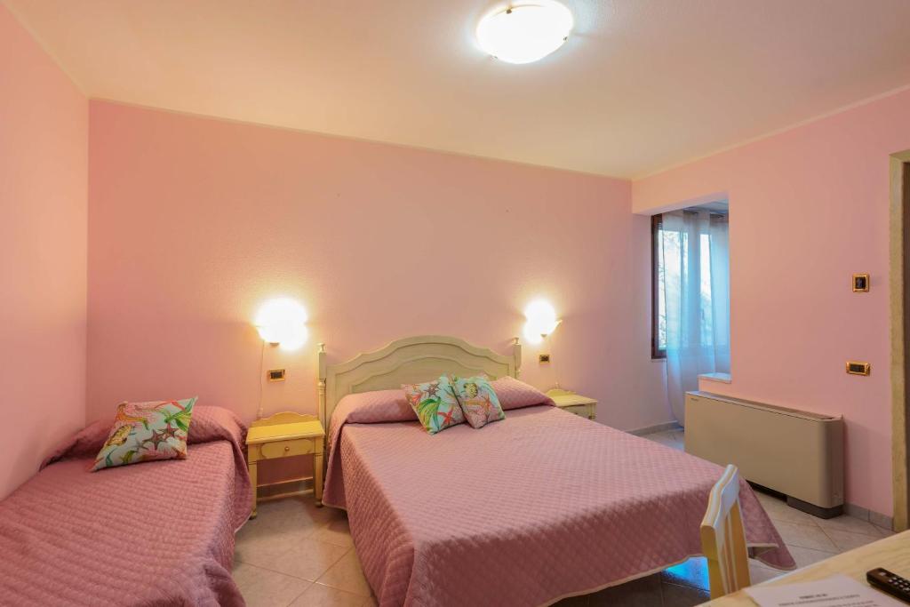 Postel nebo postele na pokoji v ubytování Hotel Solanas
