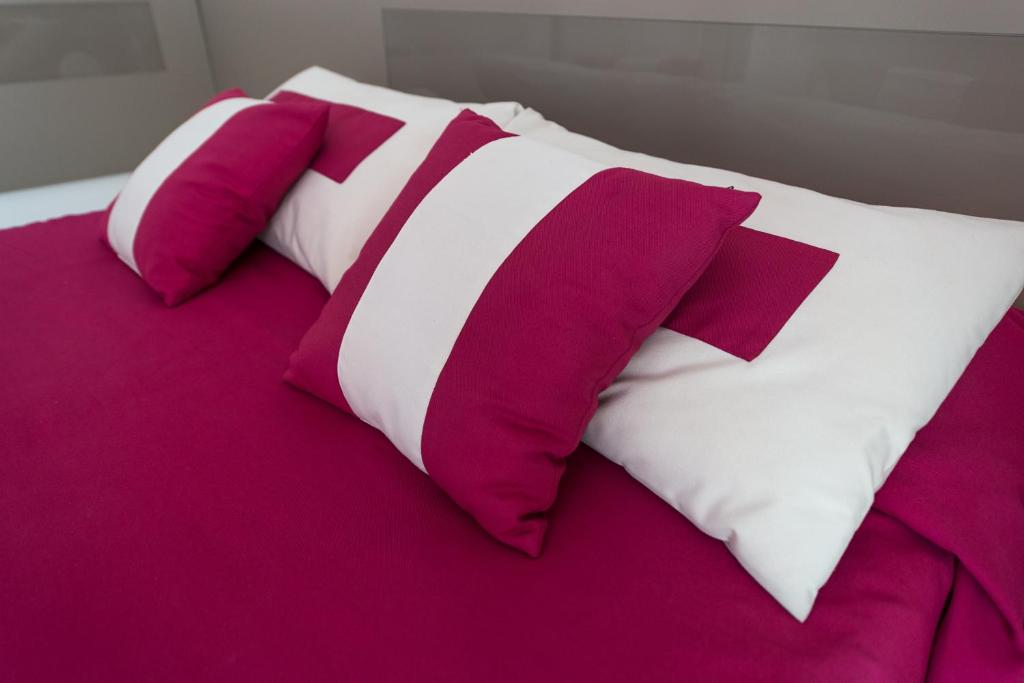 A bed or beds in a room at Zenit Hotel