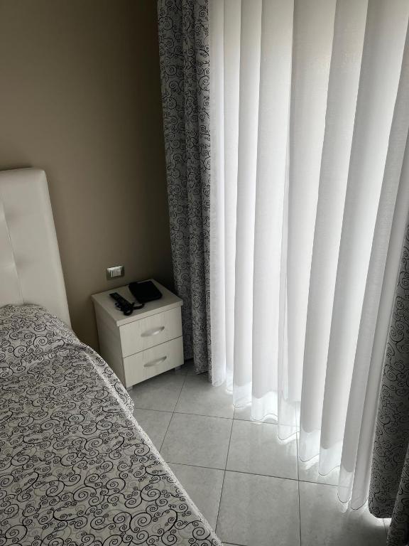 Postel nebo postele na pokoji v ubytování Hotel Marika