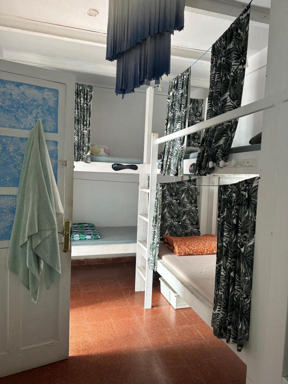 Postel nebo postele na pokoji v ubytování Agüita House