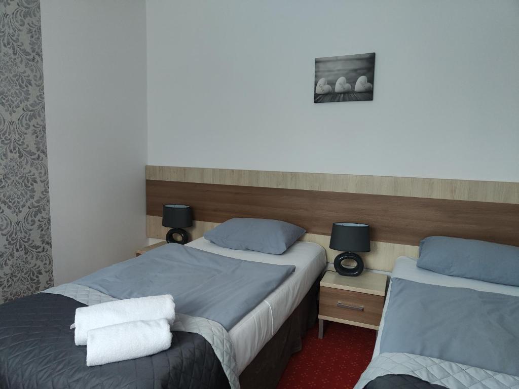 Postel nebo postele na pokoji v ubytování DW Agat
