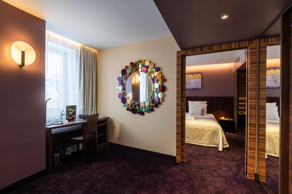 Postel nebo postele na pokoji v ubytování Avalon Hotel & Conferences