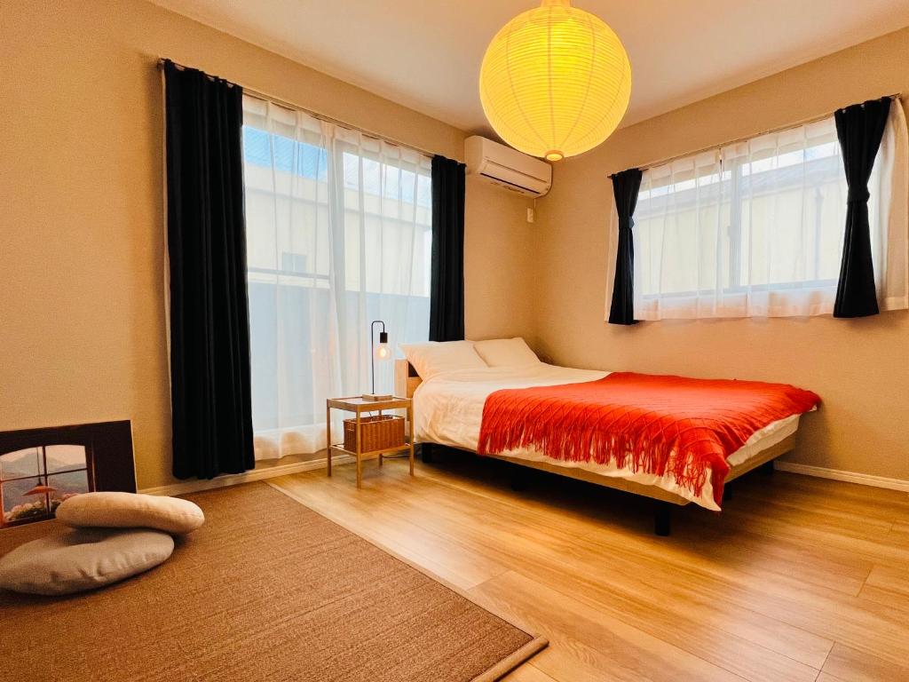 Postel nebo postele na pokoji v ubytování JoyHome 天下茶屋駅7分4LDK一軒家 難波梅田黒門関空直通 無料駐車場