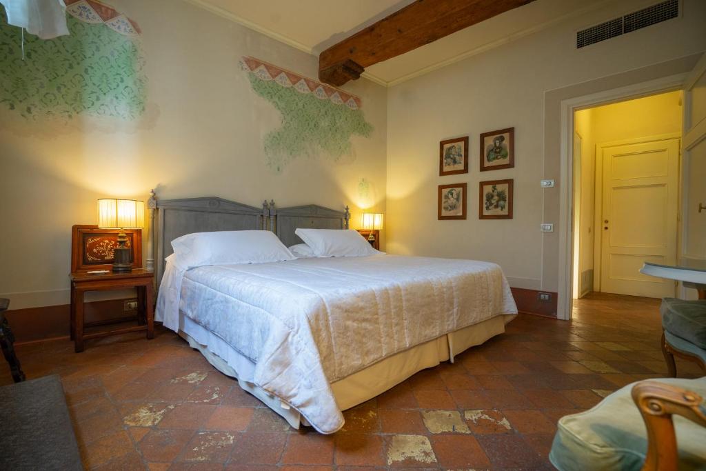 Postel nebo postele na pokoji v ubytování Palazzo Rocchi - Residenza D'Epoca