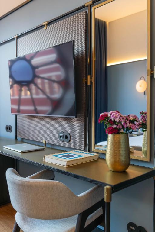 A built-in desk beside the television provides a compact work area.