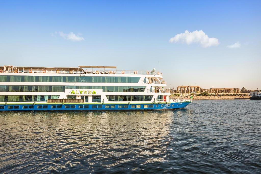 a large cruise ship on the water near a city at M/Y ALYSSA - 4 or 7 Nights From Luxor each Monday and 3 or 7 Nights From Aswan each Friday in Luxor