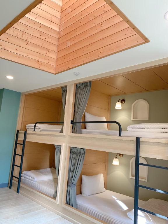 Postel nebo postele na pokoji v ubytování Minilove Homestay