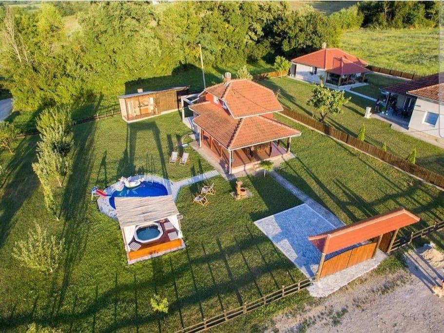 an aerial view of a house with a swimming pool at Family House Maksimović in Valjevo