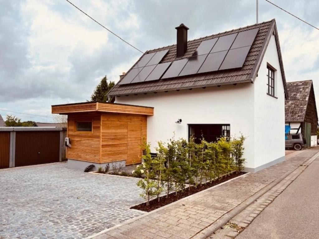 a house with solar panels on the roof at Eifel-Bau-Traum Schlich in Wershofen