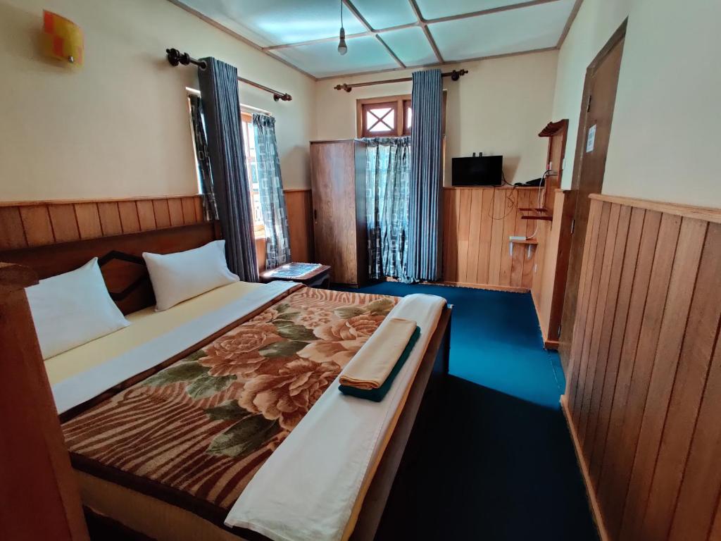 Postel nebo postele na pokoji v ubytování Carnation Rest