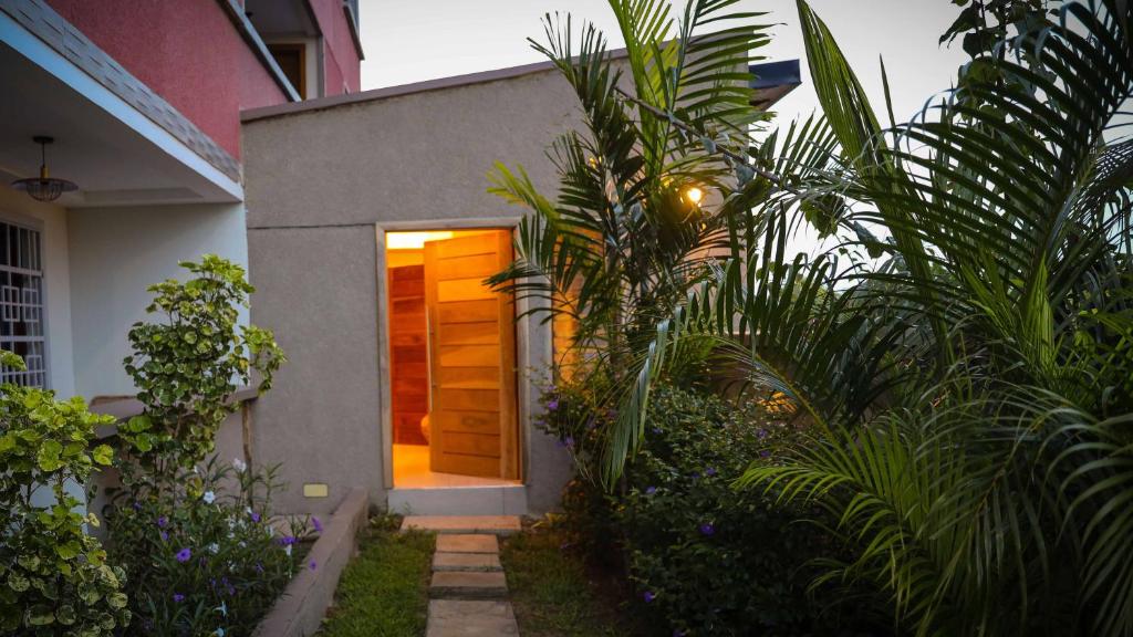 a door leading into a house with plants at ALERI'S GARDEN in Big Ada