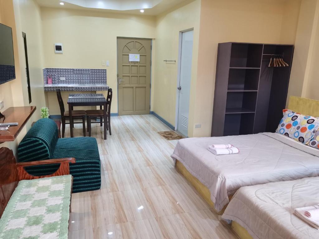 Postel nebo postele na pokoji v ubytování Siayanrock Hometel