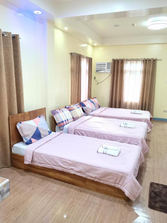 Postel nebo postele na pokoji v ubytování Siayanrock Hometel