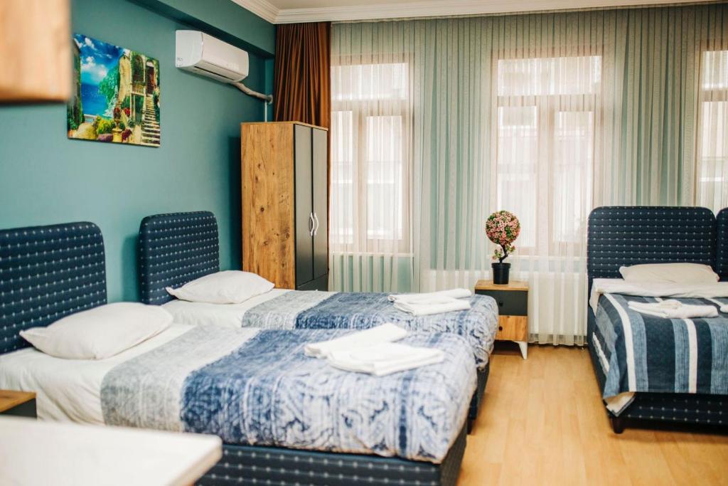 Säng eller sängar i ett rum på Ekinoks Hotel