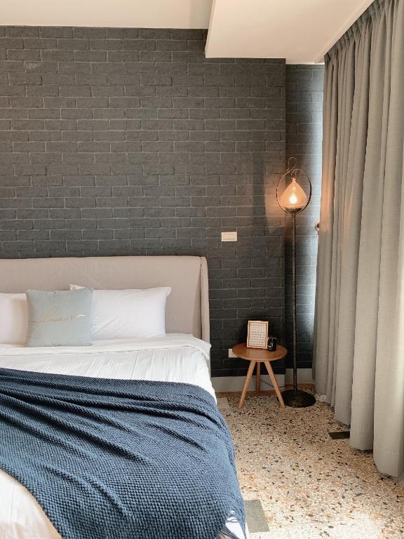 Postel nebo postele na pokoji v ubytování Minilove Homestay