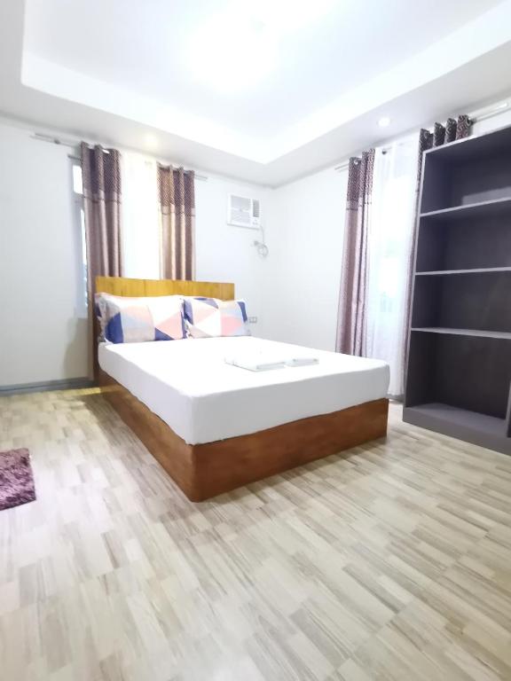 Postel nebo postele na pokoji v ubytování Siayanrock Hometel