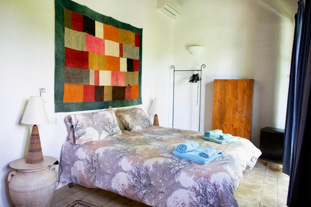 Postel nebo postele na pokoji v ubytování Agriturismo Quarantallina