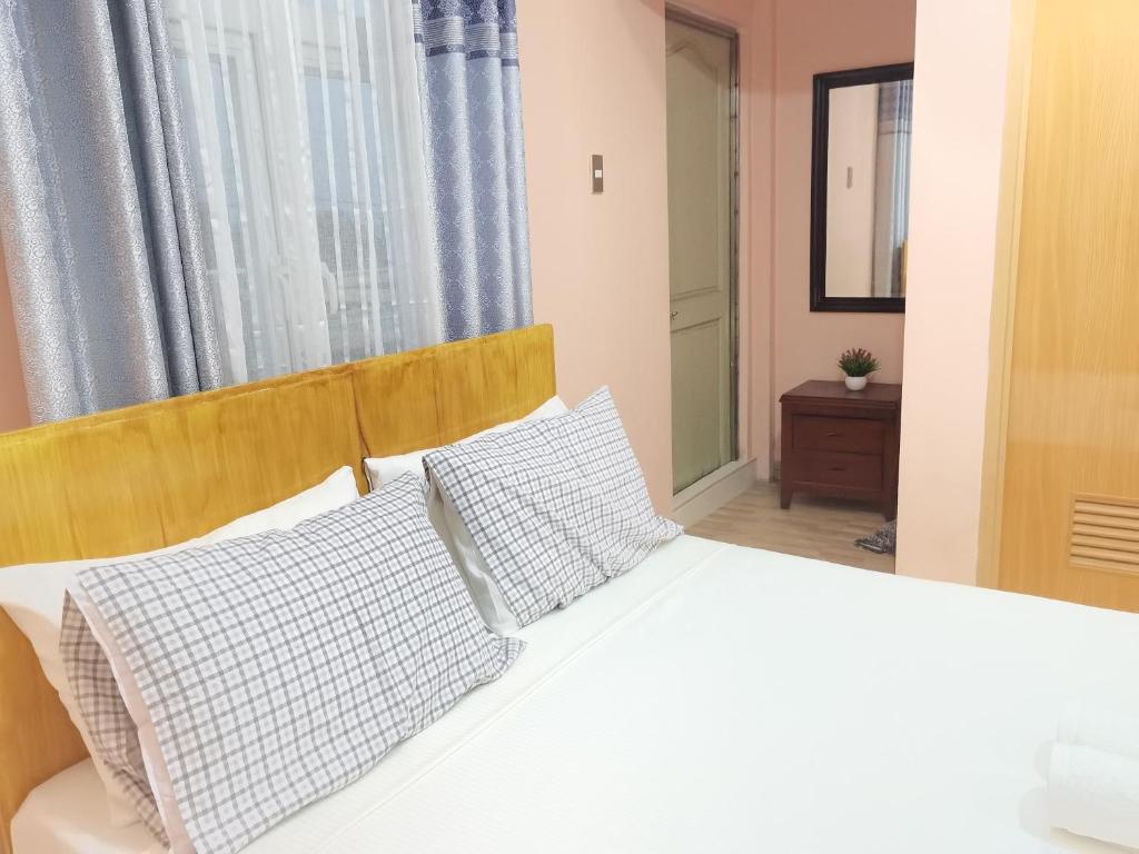 Postel nebo postele na pokoji v ubytování Siayanrock Hometel