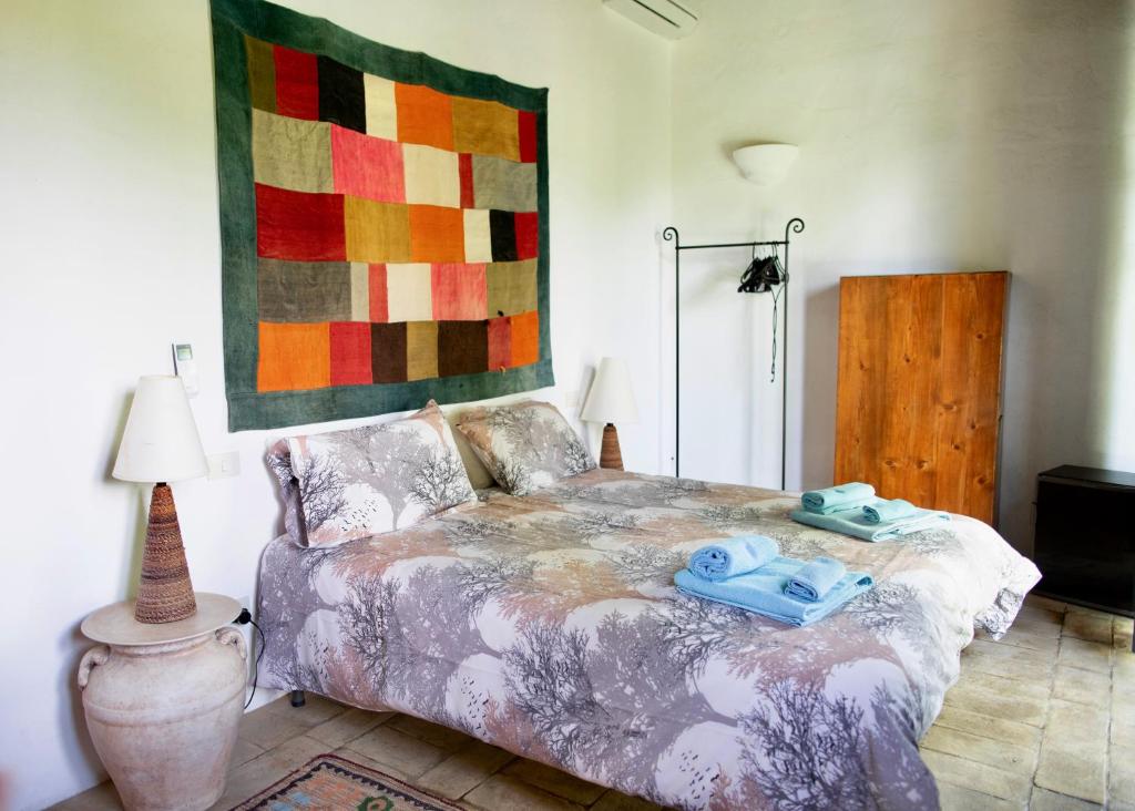 Postel nebo postele na pokoji v ubytování Agriturismo Quarantallina