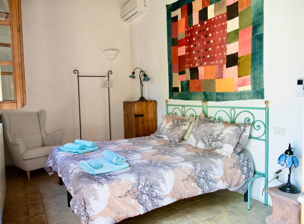Postel nebo postele na pokoji v ubytování Agriturismo Quarantallina