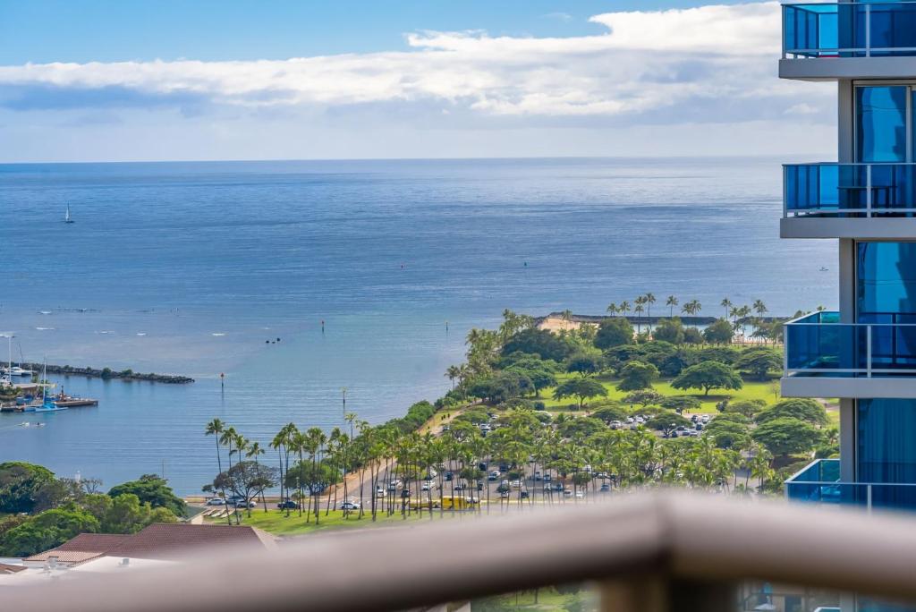 a view of the ocean from a building at Sky Ala Moana 3001 condo in Honolulu