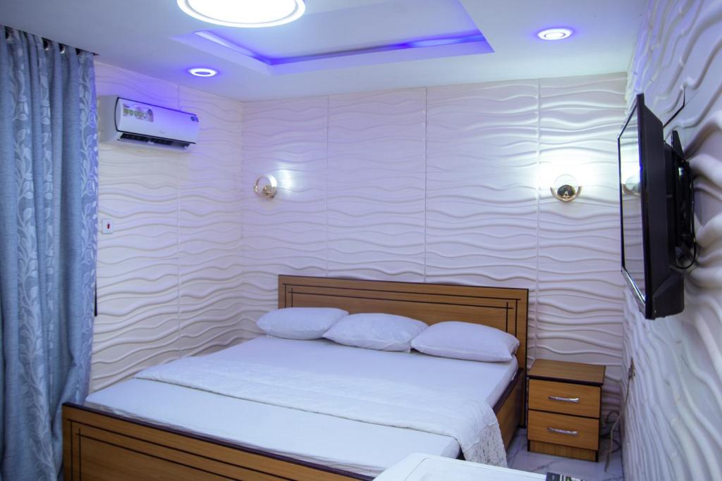 Postel nebo postele na pokoji v ubytování Haffy Executive Hotels and Suite