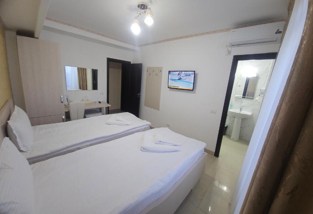 Postel nebo postele na pokoji v ubytování Hotel Marina 2
