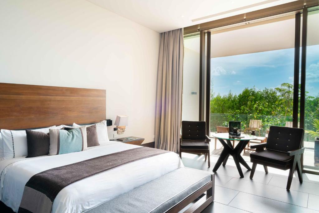 Postel nebo postele na pokoji v ubytování NIZUC Resort & Spa