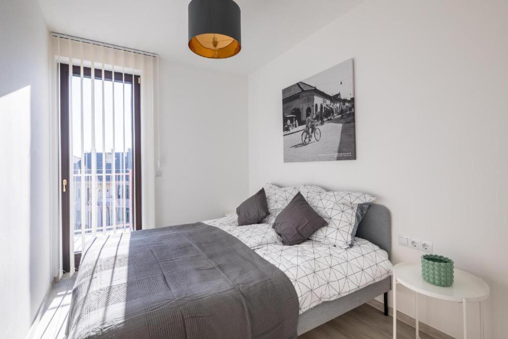 Postel nebo postele na pokoji v ubytování Stafétaház Apartmanok
