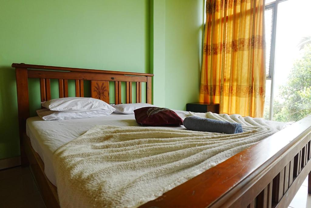 Postel nebo postele na pokoji v ubytování Suisse View Residence Kandy
