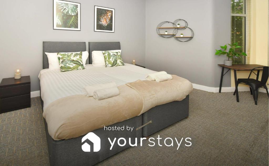 a bedroom with a large bed in a room at Alexandra Terrace by YourStays in Crewe