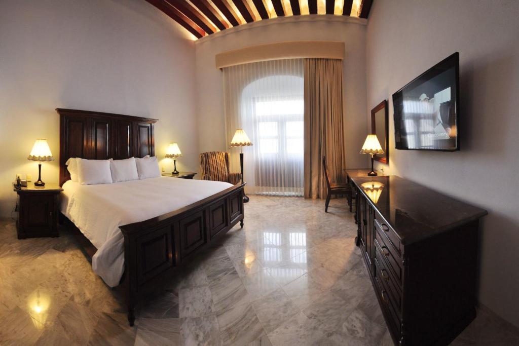 Postel nebo postele na pokoji v ubytování Hotel Lopez Campeche