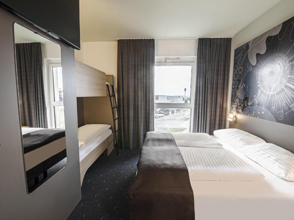 Postel nebo postele na pokoji v ubytování B&B HOTEL Wiener Neudorf