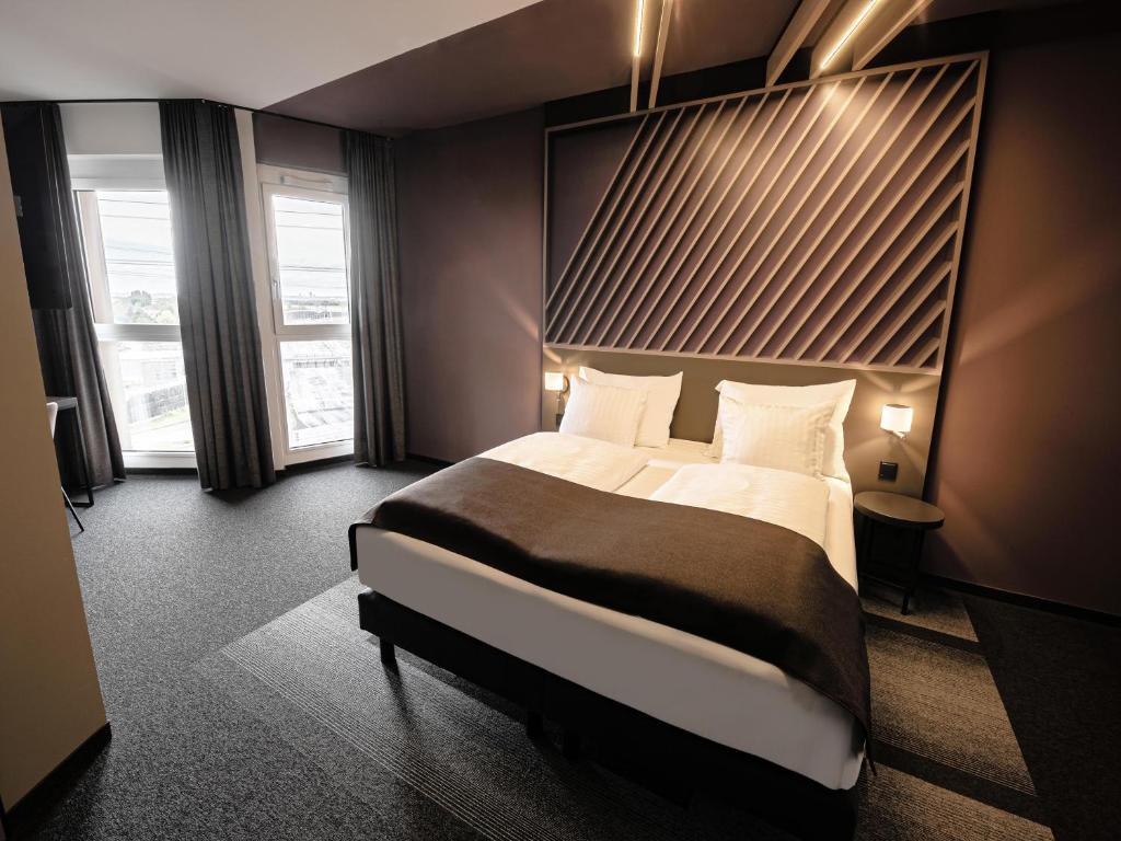 Postel nebo postele na pokoji v ubytování B&B HOTEL Wiener Neudorf