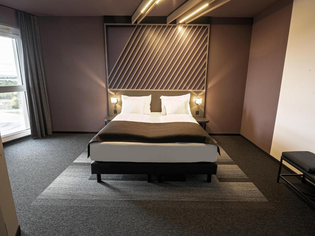 Postel nebo postele na pokoji v ubytování B&B HOTEL Wiener Neudorf