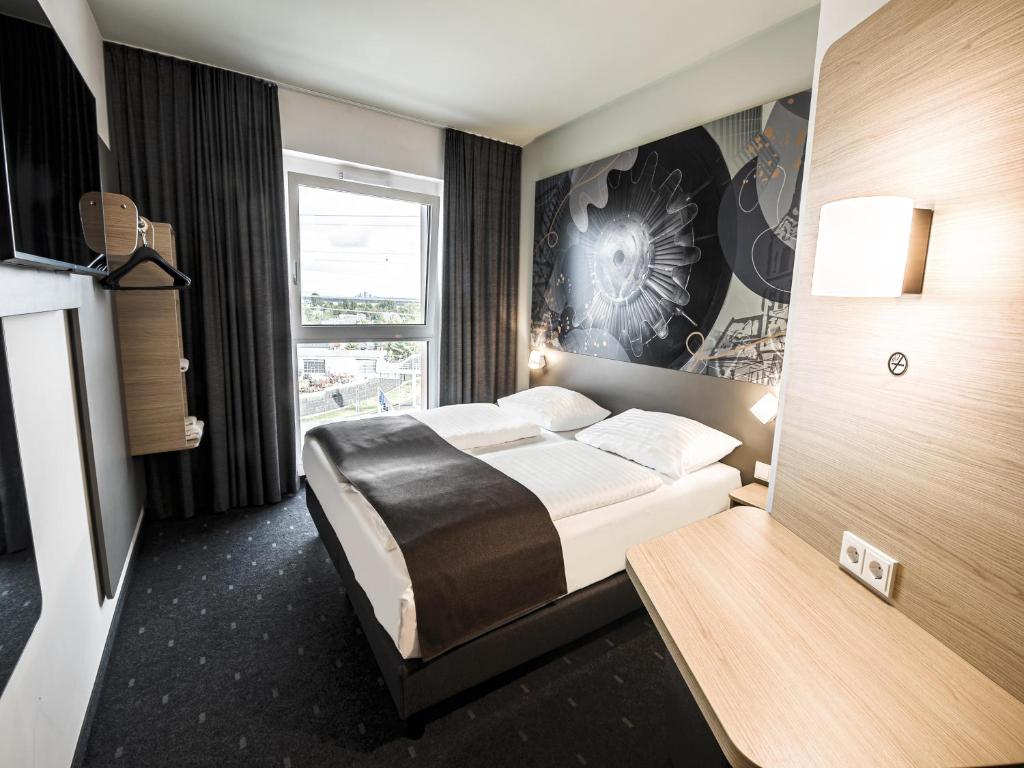 Postel nebo postele na pokoji v ubytování B&B HOTEL Wiener Neudorf
