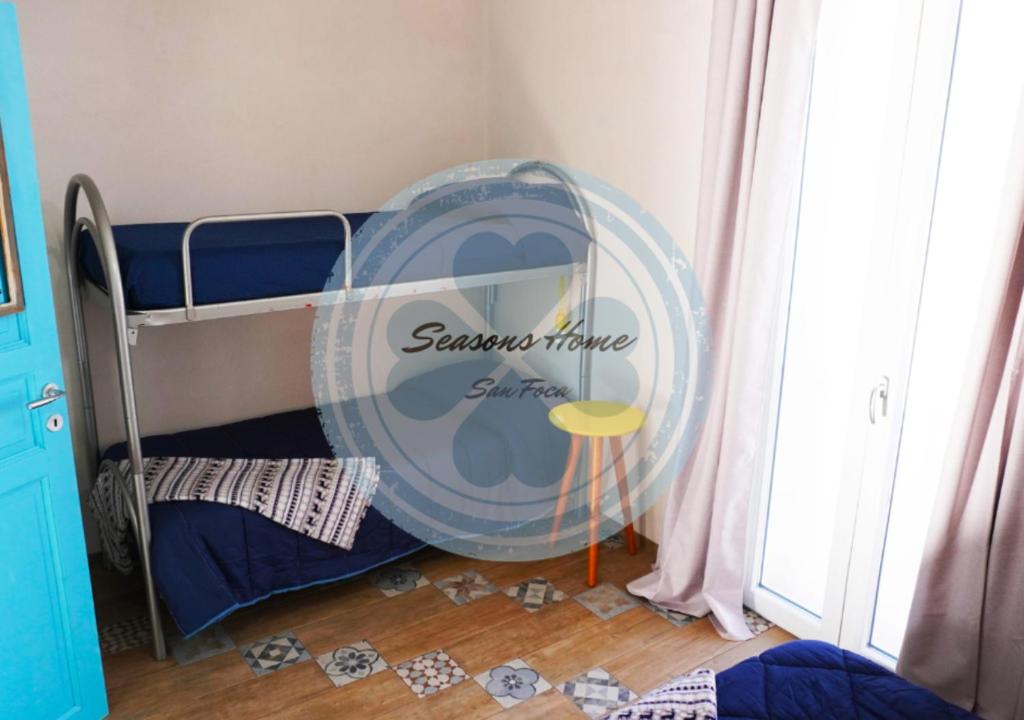 Łóżko lub łóżka w pokoju w obiekcie Seasons Home San Foca