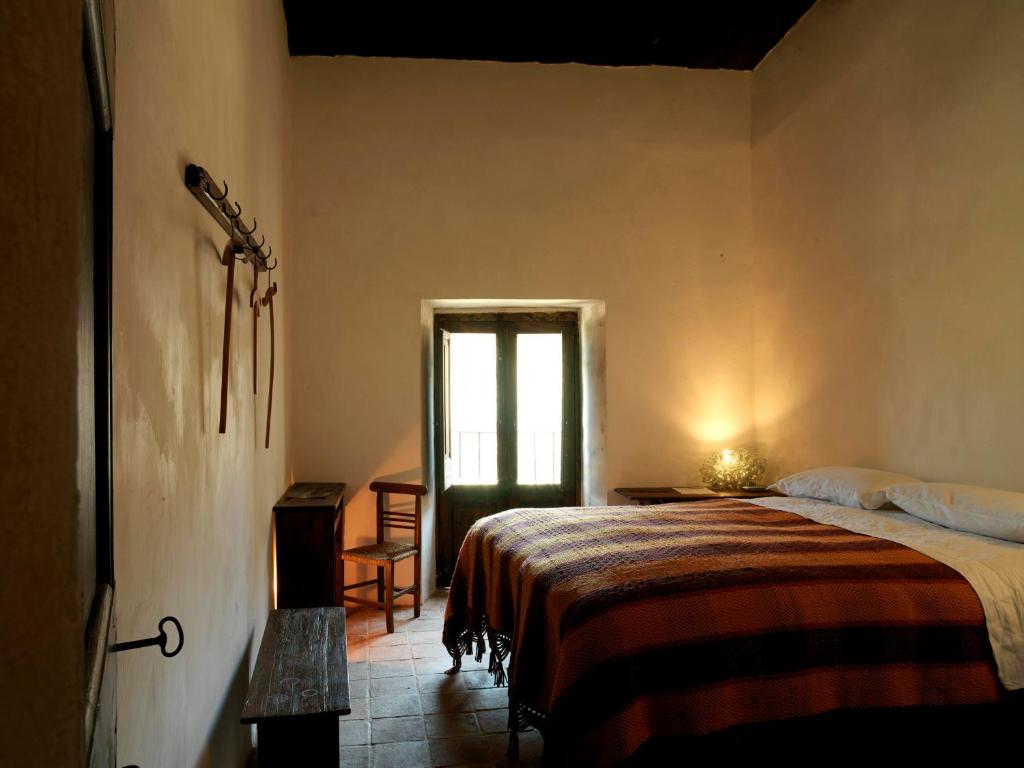 Postel nebo postele na pokoji v ubytování Sextantio Albergo Diffuso