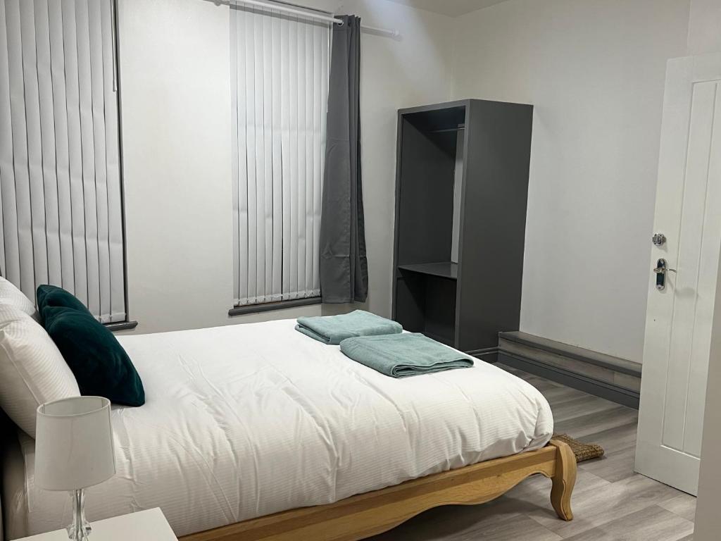 Кровать или кровати в номере En-suite room