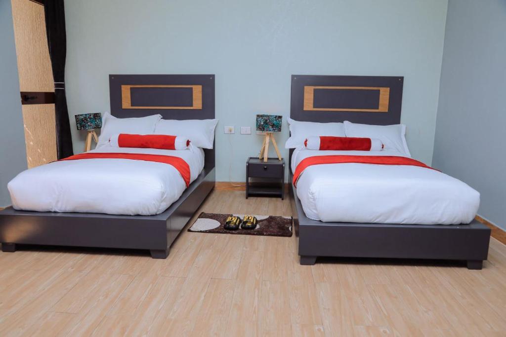 Ліжко або ліжка в номері Fenet Hawassa Hotel