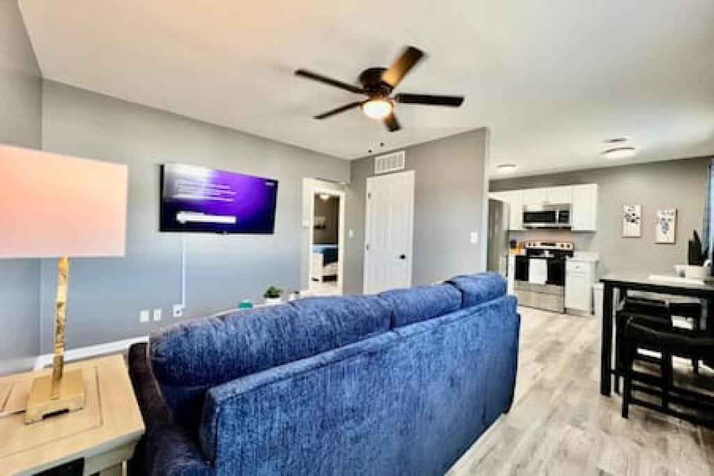 a blue couch in a living room with a ceiling fan at Sleek remodeled Design 2 Bed Trenton, OH Apartment in Trenton