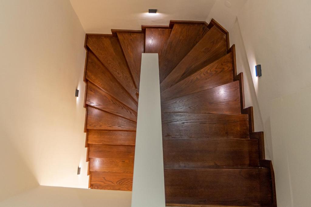 a staircase with wood paneling in a house at Samos Tropic Apartments in Ríva