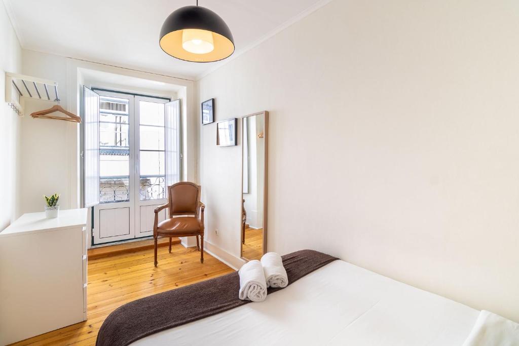 Postel nebo postele na pokoji v ubytování Diario de Noticias by Central Hill Apartments